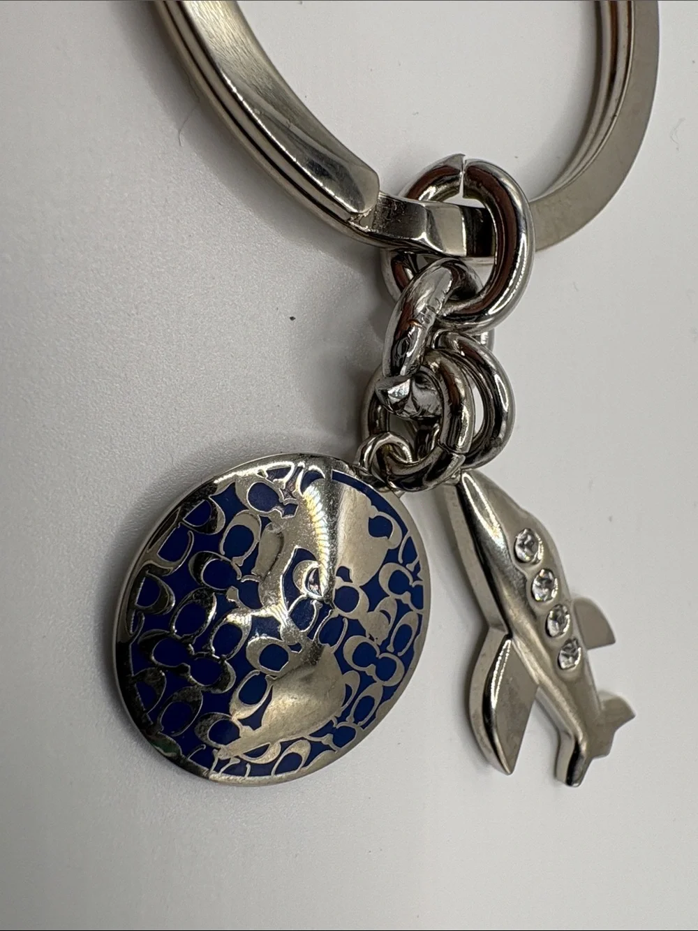 Coach Silver Airplane Keychain with Navy Enamel Glob Charm